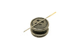 Button side needle minder with pin
